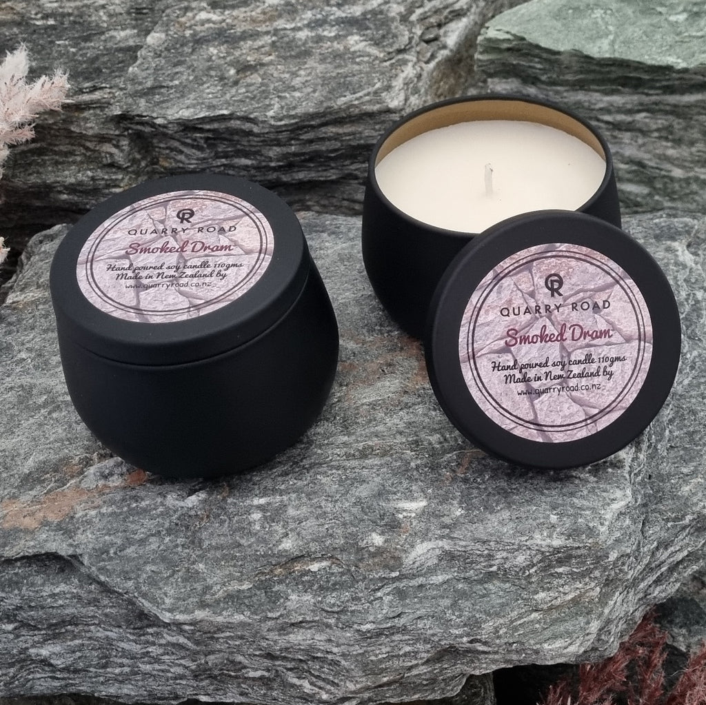 Quarry Road 110g candle Smoked Dram fragrance resting on our quarry schist.