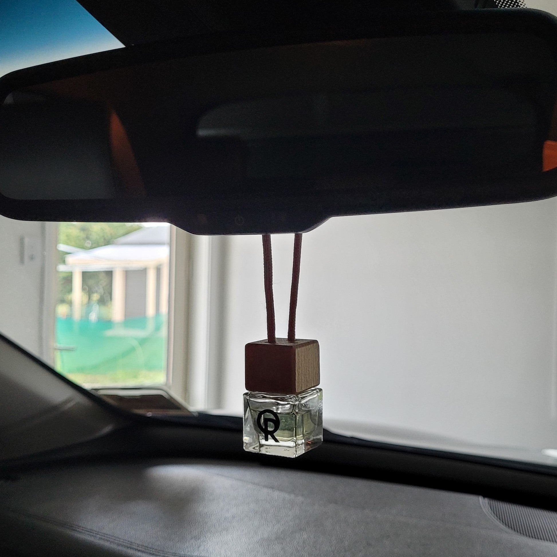 Small air diffuser hanging in the car tied around the mirror, made by Quarry Road.